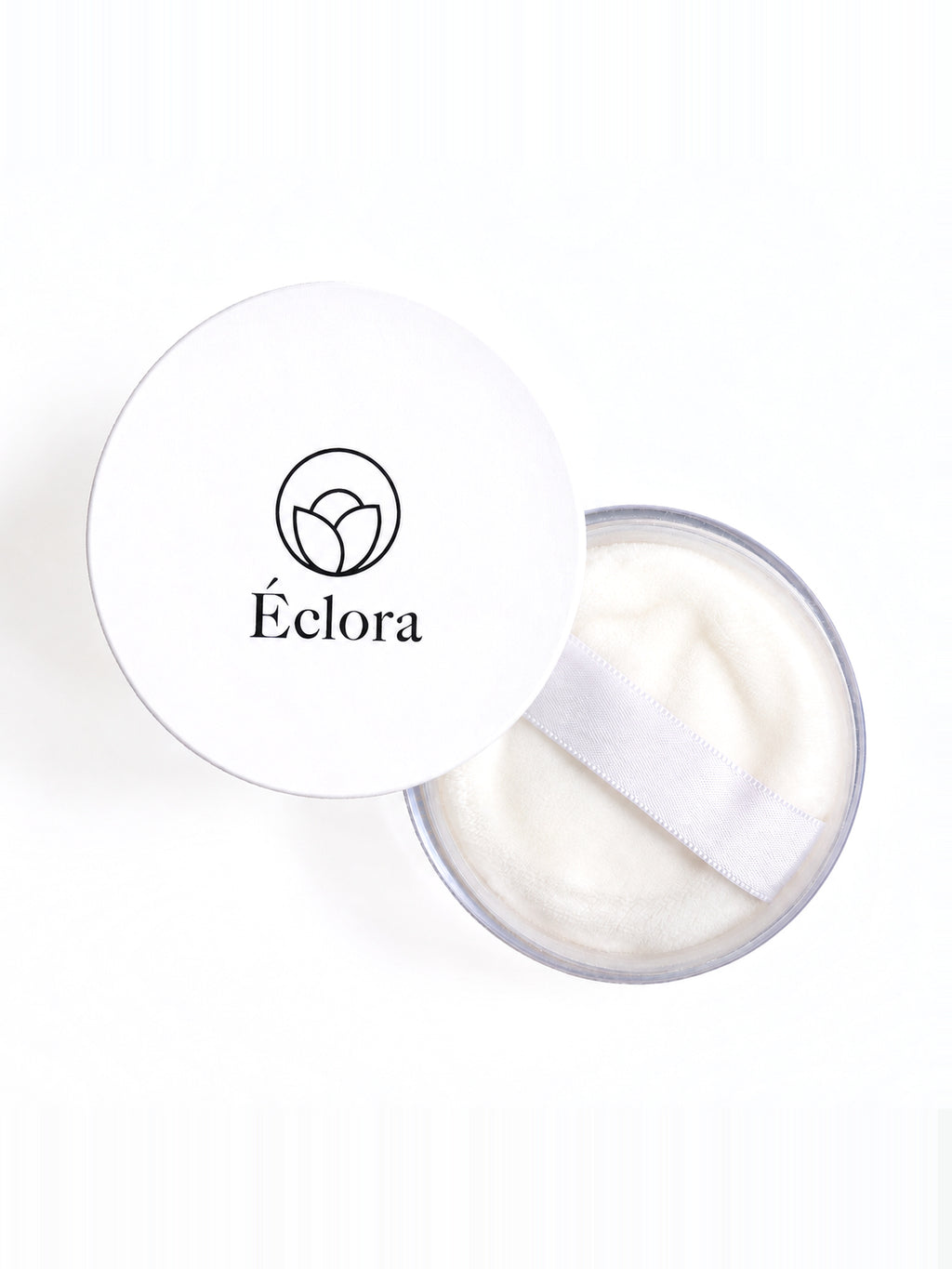真上から見た ÉCLORA ルースパウダー 01。ふたを外した本体に、付属のパフが入っている