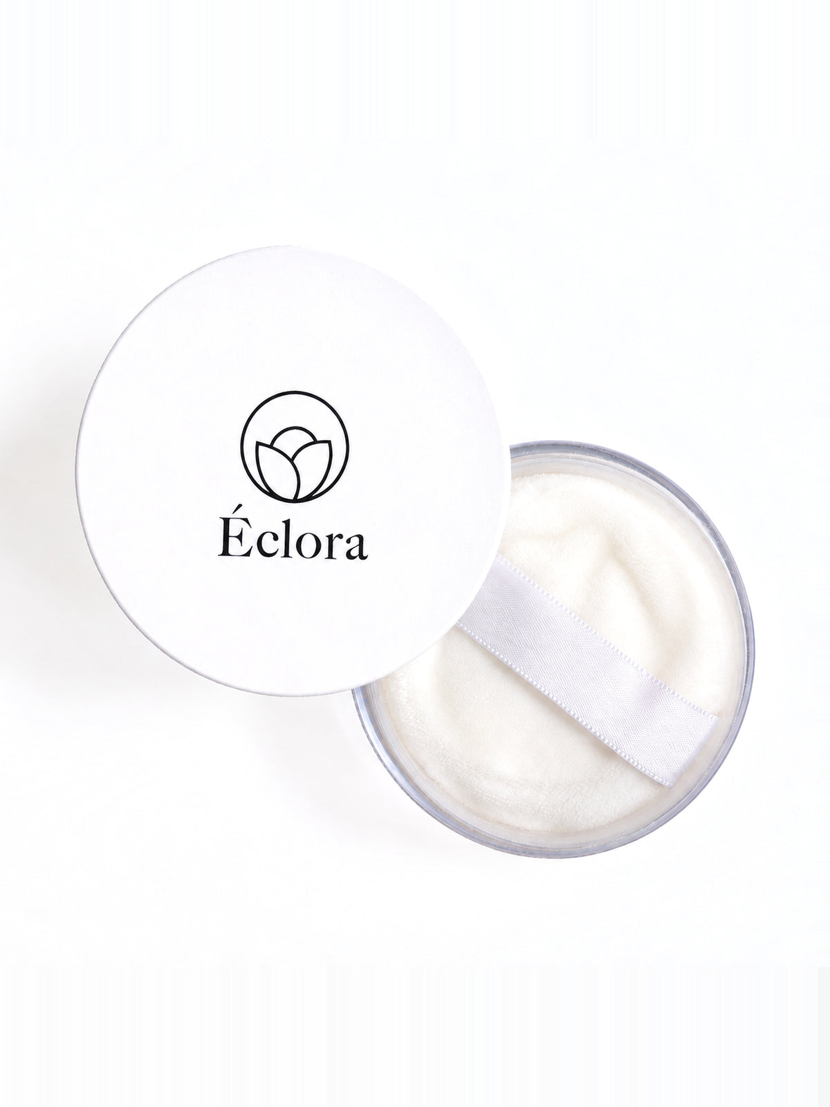 真上から見た ÉCLORA ルースパウダー 01。ふたを外した本体に、付属のパフが入っている